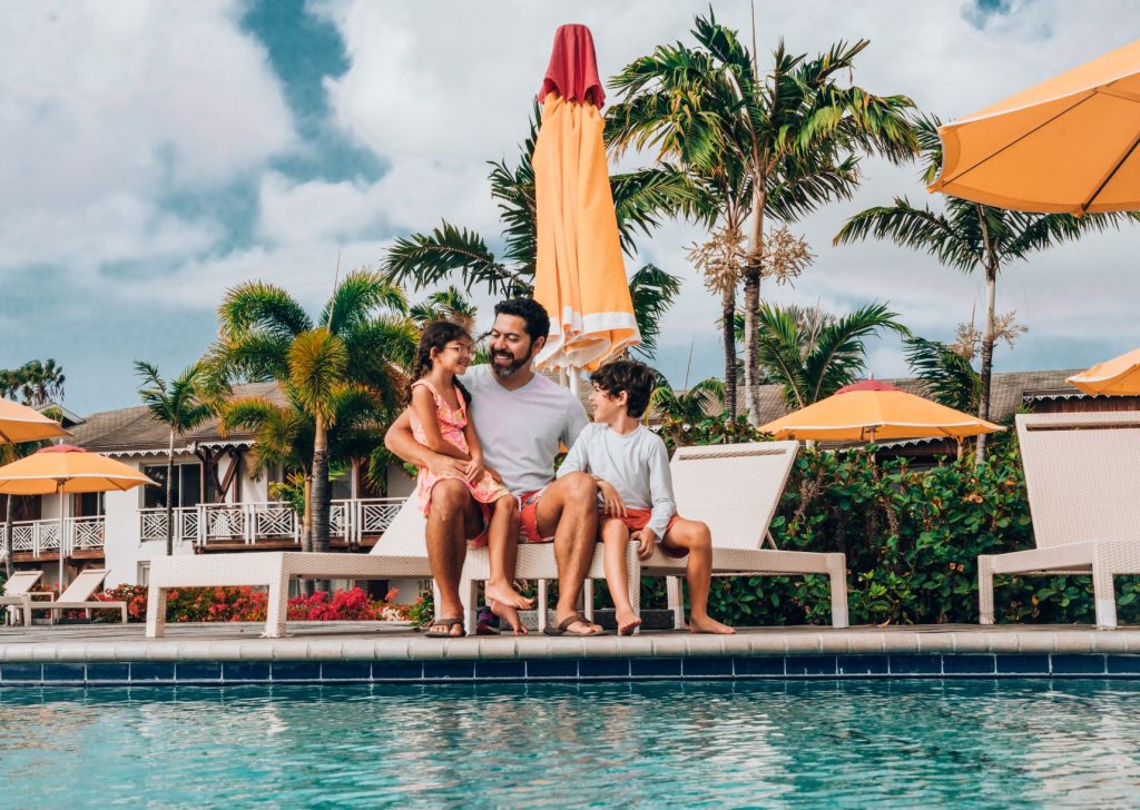 sitting by the pool at Four Seasons Nevis