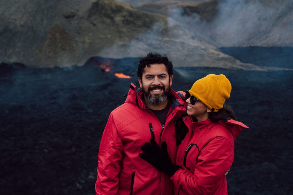 taking a picture in front of a volcano in iceland