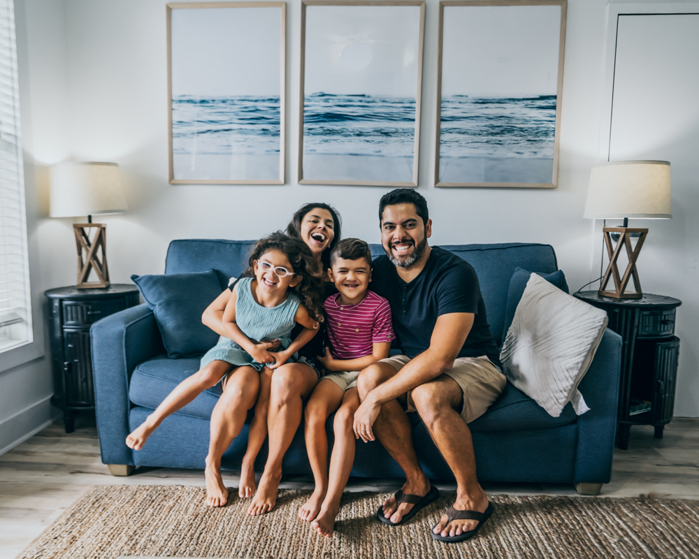 family sitting on couch