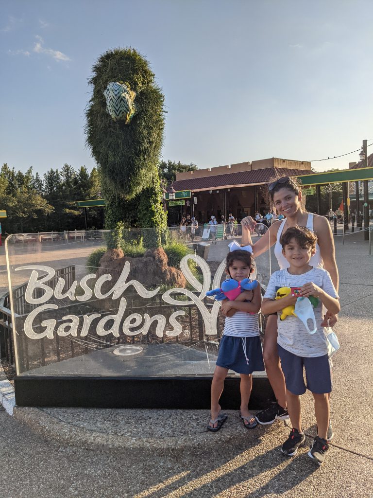 taking a picture at the entrance to busch gardens in tampa