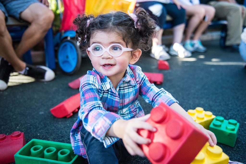 girl playing with Legos at Legoland